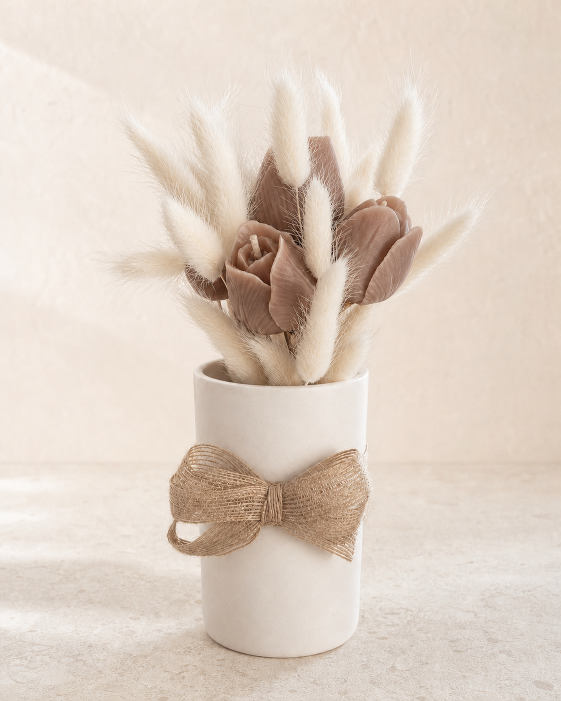 Taupe sculptural tulip candles with ivory bunny tails in a white vase