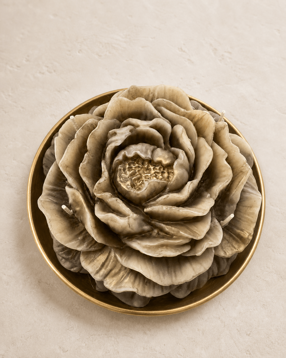 Overhead detail of a large taupe and ivory sculptural peony bowl candle