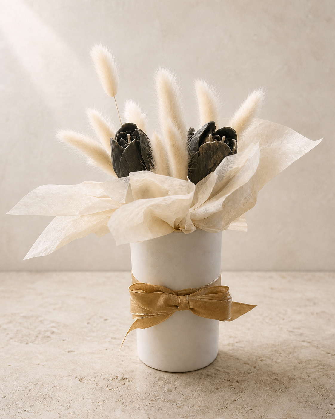 Charcoal tulip candles with ivory bunny tails in a white cylinder vase