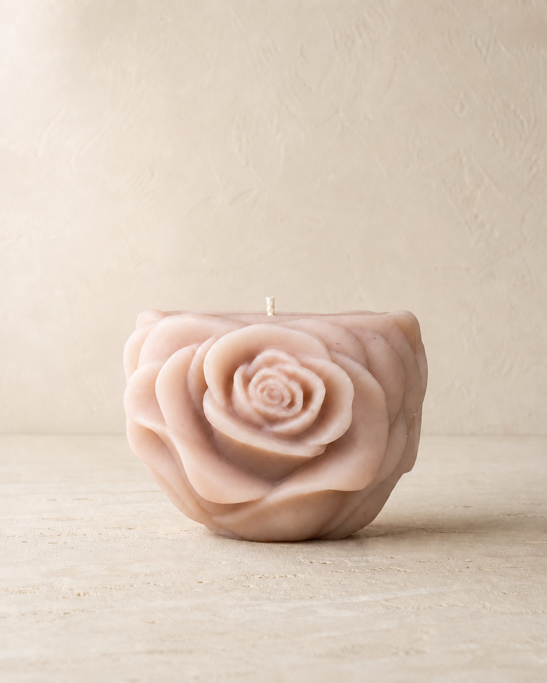 Blush sculptural vessel candle shaped with layered rose petals