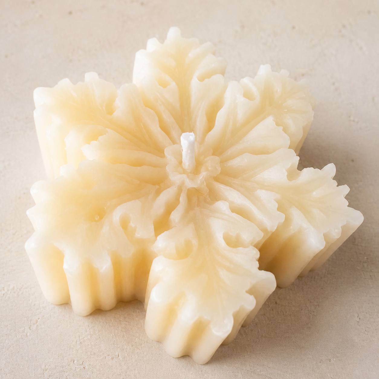 Ivory floral snowflake candle