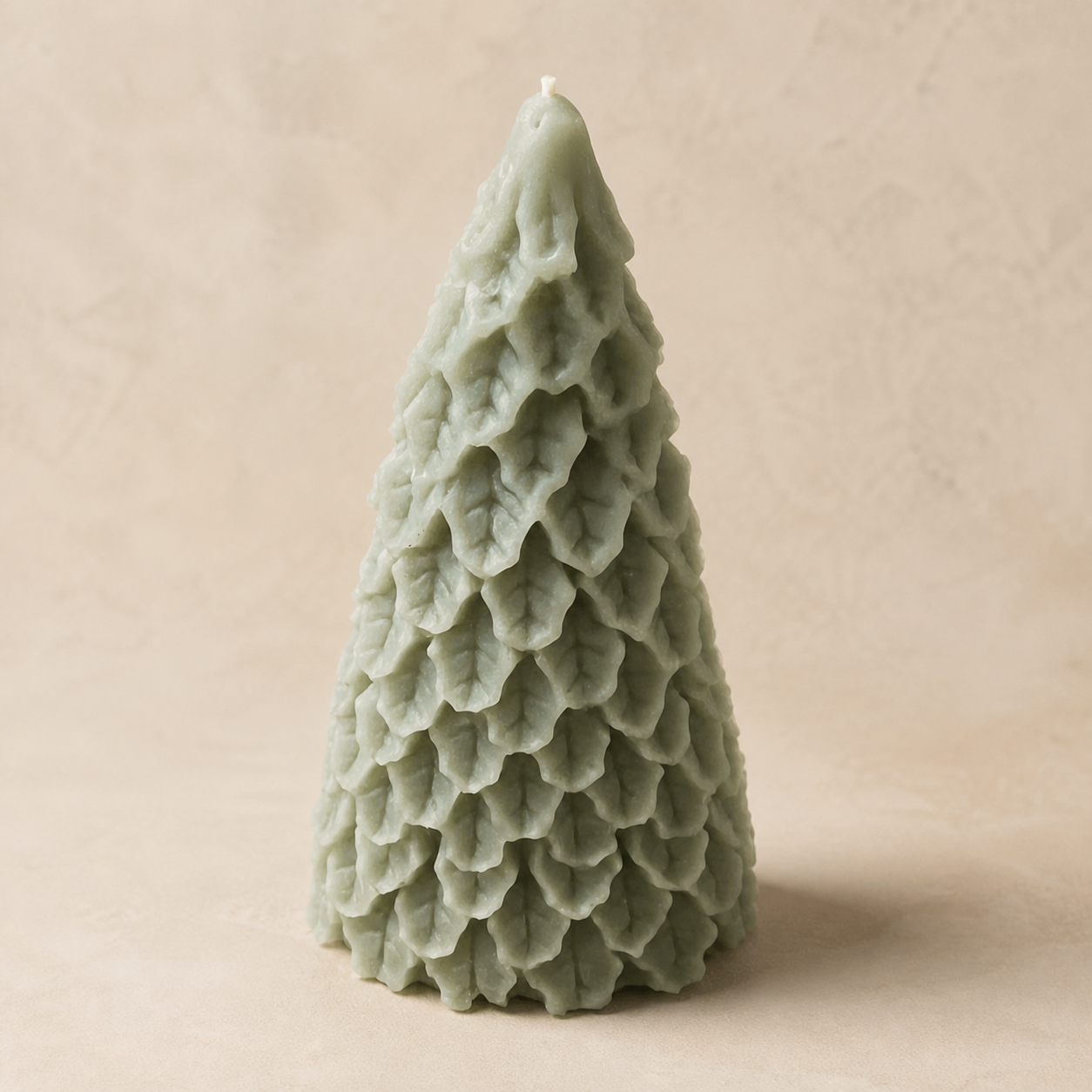 Sage holiday tree candle with snow-draped details